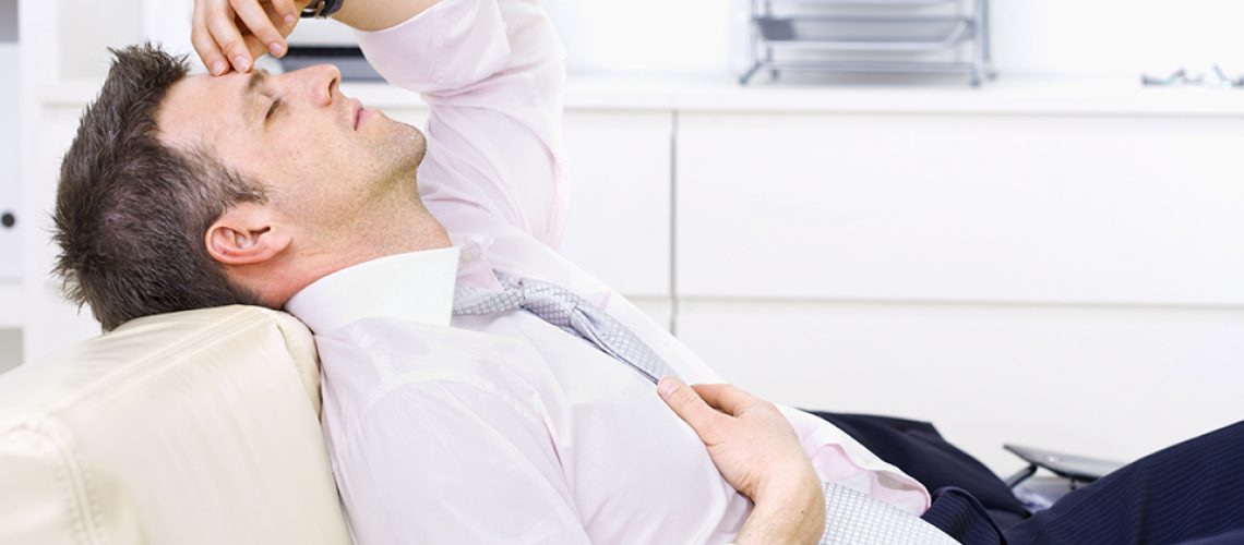 Mid-adult businessman lying on couch at office, looking exhausted eyes closed. Bright background. Click here for more business photos:  [url=my_lightbox_contents.php?lightboxID=1500413][img]https:// www.nitorphoto.com/istocklightbox/businesspeople.jpg[/img][/url]  [url=my_lightbox_contents.php?lightboxID=3209528][img]https:// www.nitorphoto.com/istocklightbox/beigebusiness.jpg[/img][/url]  [url=my_lightbox_contents.php?lightboxID=1800848][img]https:// www.nitorphoto.com/istocklightbox/customerservice.jpg[/img][/url]  [url=my_lightbox_contents.php?lightboxID=1708462][img]https:// www.nitorphoto.com/istocklightbox/womeninbusiness.jpg[/img][/url]  [url=my_lightbox_contents.php?lightboxID=3058977][img]https:// www.nitorphoto.com/istocklightbox/seniorbusinesswoman.jpg[/img][/url]